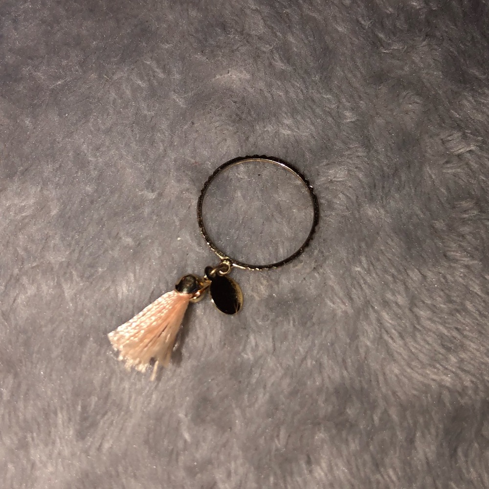 Thin ring with a cute fringe string